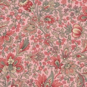 Intricate floral pattern in soft pink and green hues on fabric.