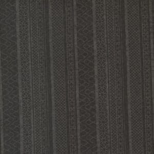 Close-up of dark fabric with subtle vertical pinstripes.