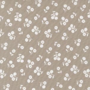 Beige fabric with small white floral pattern.