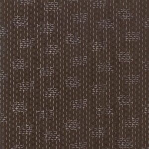 Brown textured fabric with a repeating pattern of small geometric shapes.