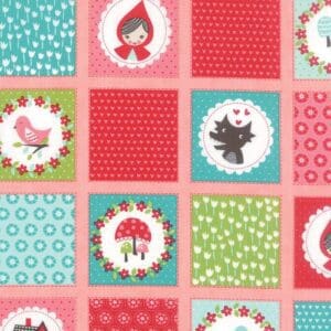 Colorful patchwork quilt with playful animal and pattern squares.