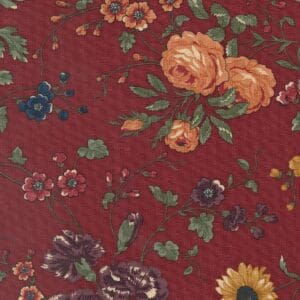 Floral pattern with vibrant flowers on a deep red background.