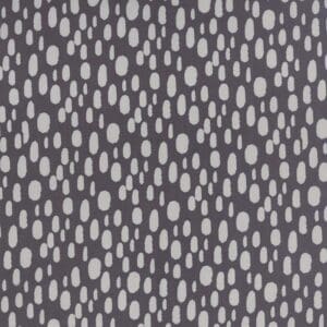 Gray fabric with white irregular oval dots pattern.