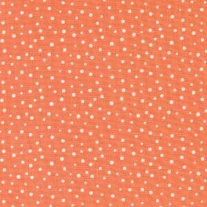 Orange fabric with small white polka dots pattern.