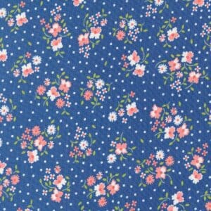 Floral pattern with small pink and white flowers on a blue background.