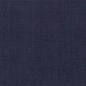 Dark blue textured fabric background with subtle weave pattern.