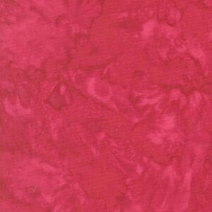 Close-up of a red textured surface with swirling patterns.