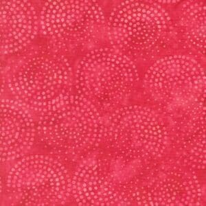 Red patterned fabric with circular dot designs.