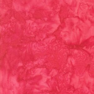 Close-up of a textured red fabric with a marbled pattern.