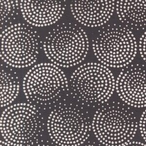 Black fabric with white dotted circular patterns.