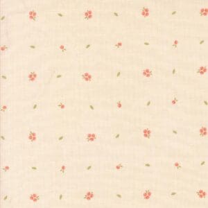 Light beige fabric with small pink floral patterns arranged in a grid.