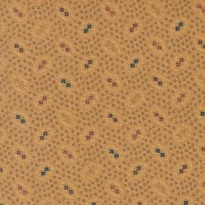 Textured fabric with a repeating pattern of small floral motifs on a warm brown background.