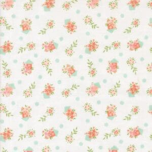 Delicate floral pattern with small orange and pink flowers on a white background.