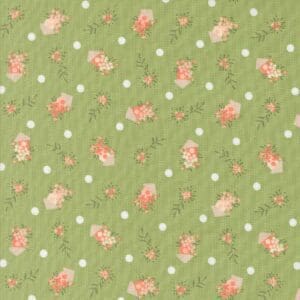 Green fabric with small pink and white floral pattern.