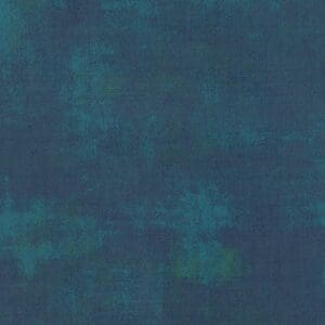 Abstract textured background in dark teal and blue tones.