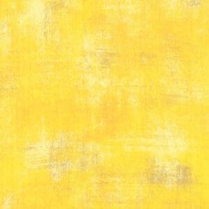 Textured yellow background with subtle white and gray patches.
