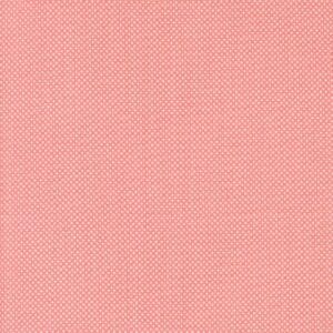 Textured pink fabric with a subtle woven pattern.