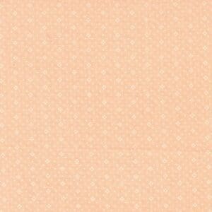 Peach-colored fabric with small white floral patterns.