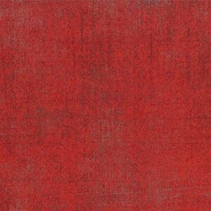 Textured red fabric with subtle variations in tone.