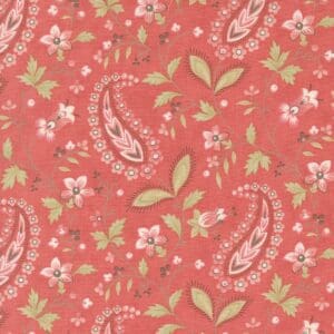 Floral and paisley pattern on a coral background.