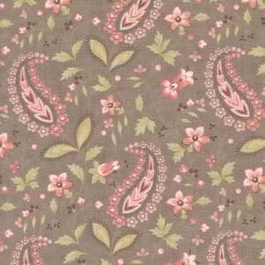 Floral and paisley patterned fabric in muted tones.