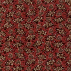 Intricate floral pattern on a red textured fabric.
