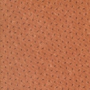 Close-up of textured brown leather with small perforations.