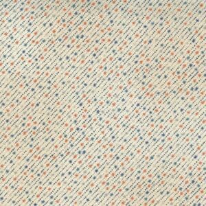 Close-up of a textured fabric with a multicolored speckled pattern.