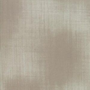 Textured beige fabric with subtle variations in tone.