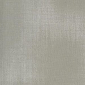 Close-up of a textured, neutral-toned fabric surface.