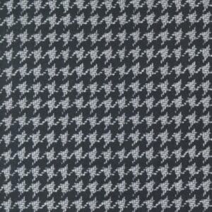 Classic black and white houndstooth fabric pattern.
