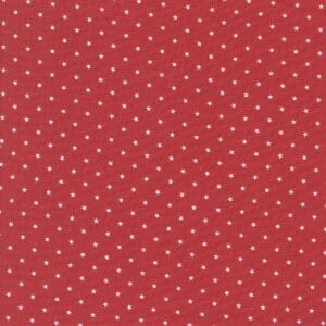 Red fabric with small white polka dots pattern.