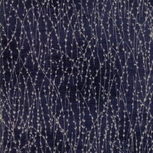 Dark fabric with silver dotted lines forming a flowing pattern.