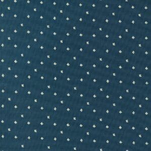 Blue fabric with small white polka dots arranged evenly.