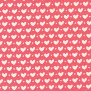 Pattern of white hearts on a pink background.