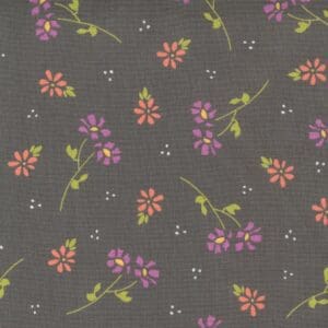 Floral pattern with small purple and orange flowers on a gray background.