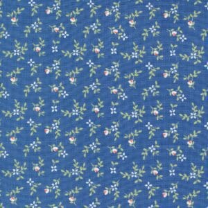 Blue fabric with small white floral patterns.