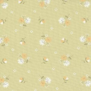 Soft yellow fabric with delicate white and orange floral pattern.