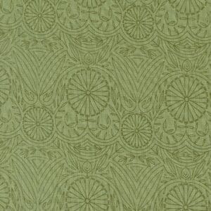 Green fabric with intricate floral and circular patterns.