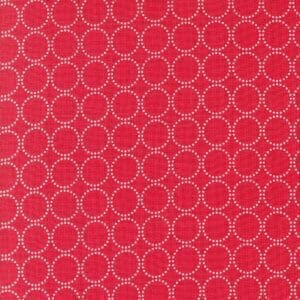 Red fabric with white circular chain-link pattern.