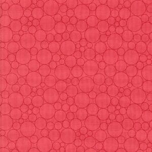 Red textured surface with circular patterns.