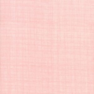 Soft pink textured fabric with a subtle woven pattern.