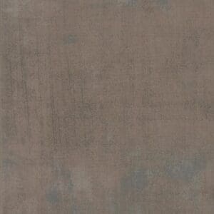 A textured surface with muted brown and gray tones.