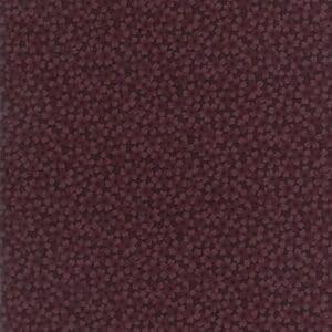 Close-up of textured dark brown leather surface.