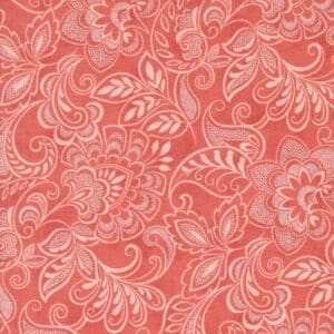 Intricate floral pattern in coral and white.