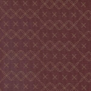 Intricate brown fabric with geometric and floral patterns.