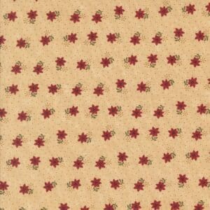 Vintage fabric with small red floral patterns on a beige background.