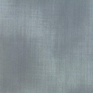 Close-up of a textured gray fabric with subtle vertical patterns.