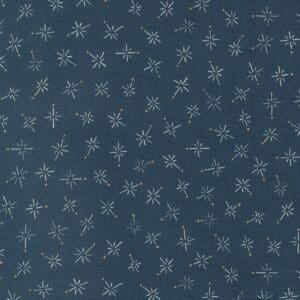 Dark blue fabric with small white snowflake patterns scattered evenly.
