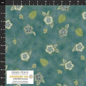 Green fabric with white floral pattern and measuring scale.